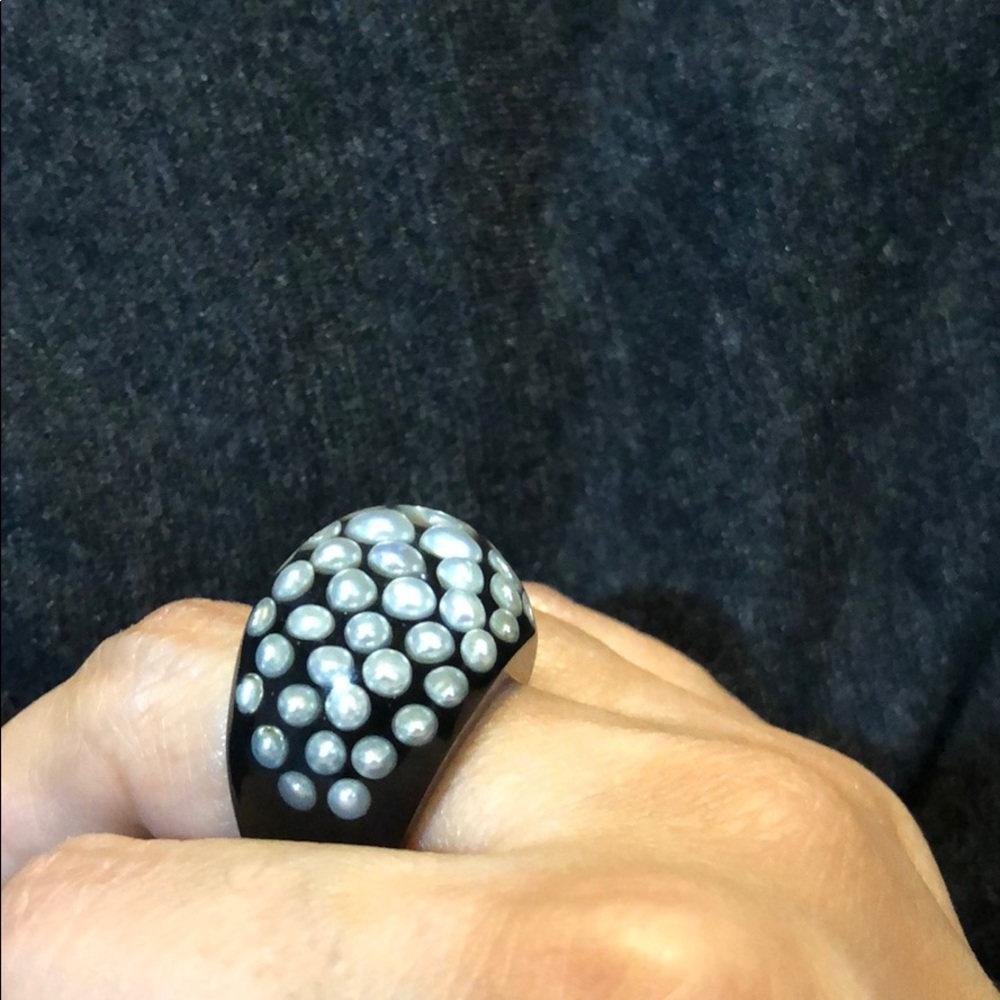 Acrylic ring. Black with embedded pearls.
